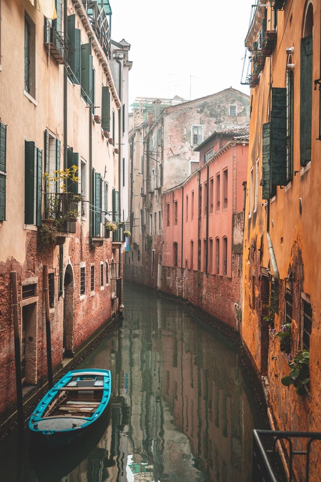 Photograph of a quiet Venice back canal with a moored boat