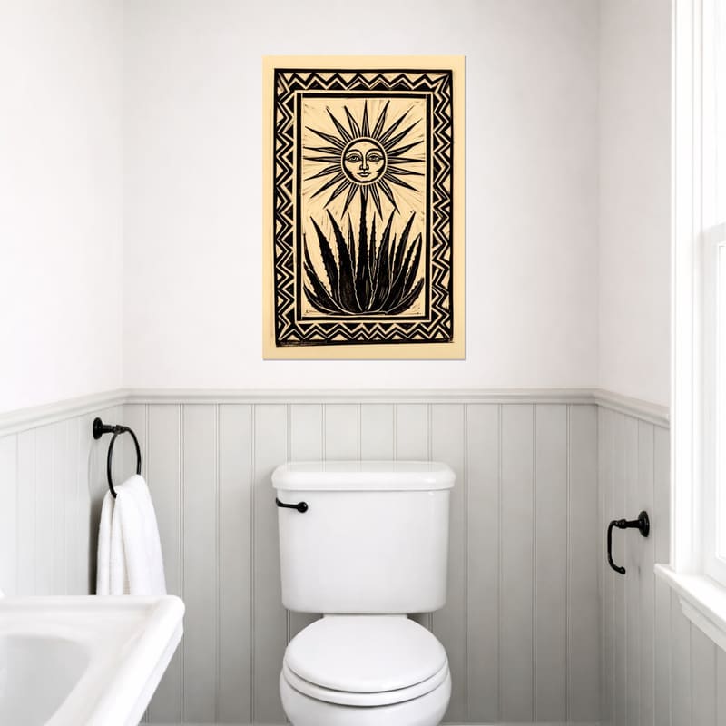 Sun & Aloe print hanging on a white paneled bathroom wall.